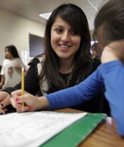 Mercedez Gomez, a senior at Santa Rosa High School, volunteers in an after-school program at Lincoln Elementary School where she helps students with their homework. Photo by Jeff Kan Lee / The Press Democrat 